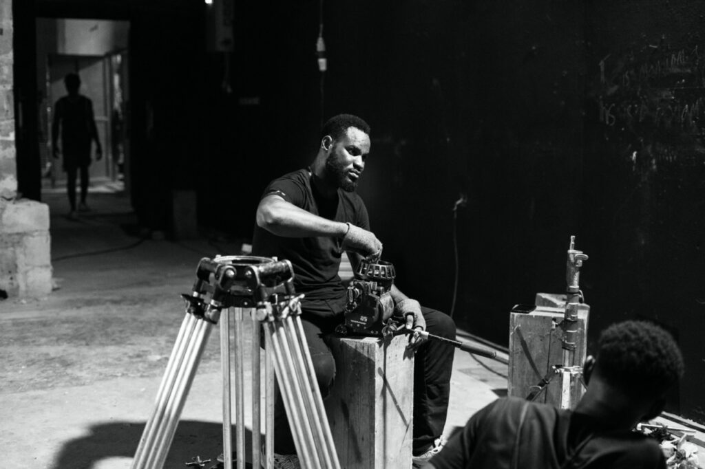 Jacob Okoli on set for The House of Secrets